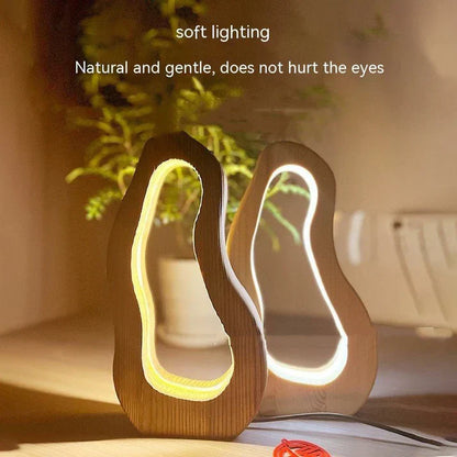 Hollow design, LED glow, wooden charm, simple style desktop lamp.